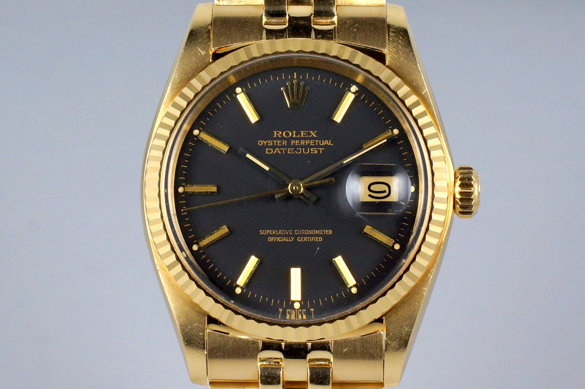 gold rolex black dial